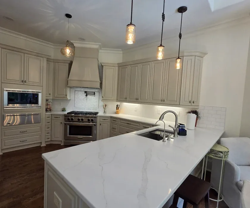Remodeled kitchen with shaker cabinets, stone countertops and tile backsplash in Charlotte, NC