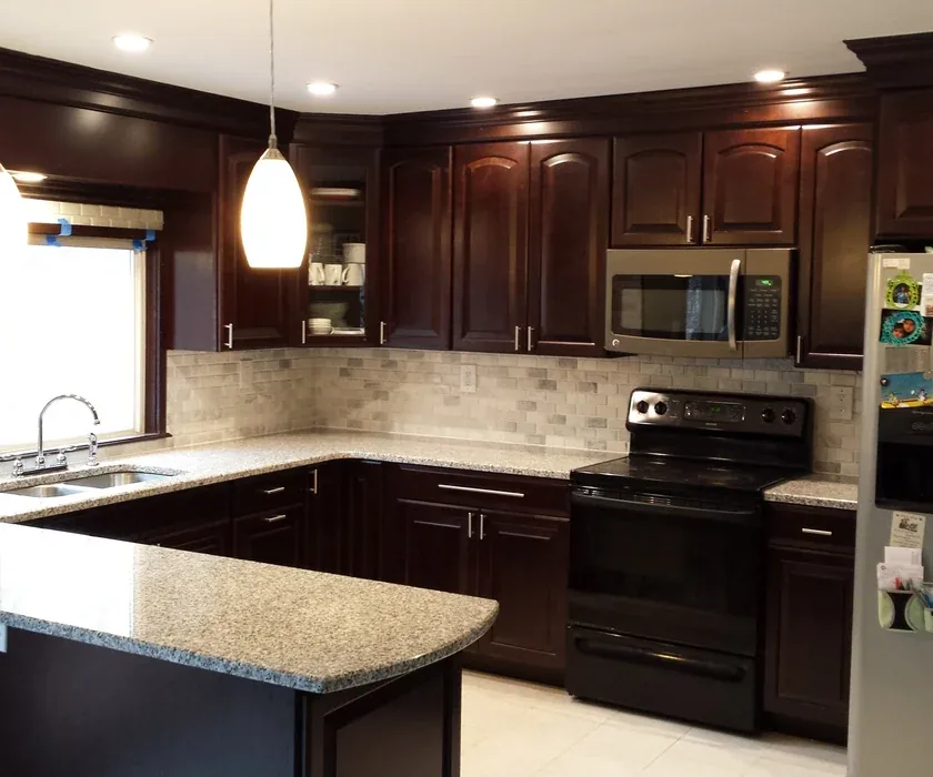 Kitchen remodel with island, new cabinetry and hardwood flooring