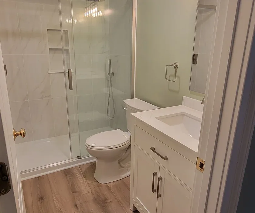 Remodeled bathroom with tiled walk-in shower and glass enclosure in a Charlotte, NC home