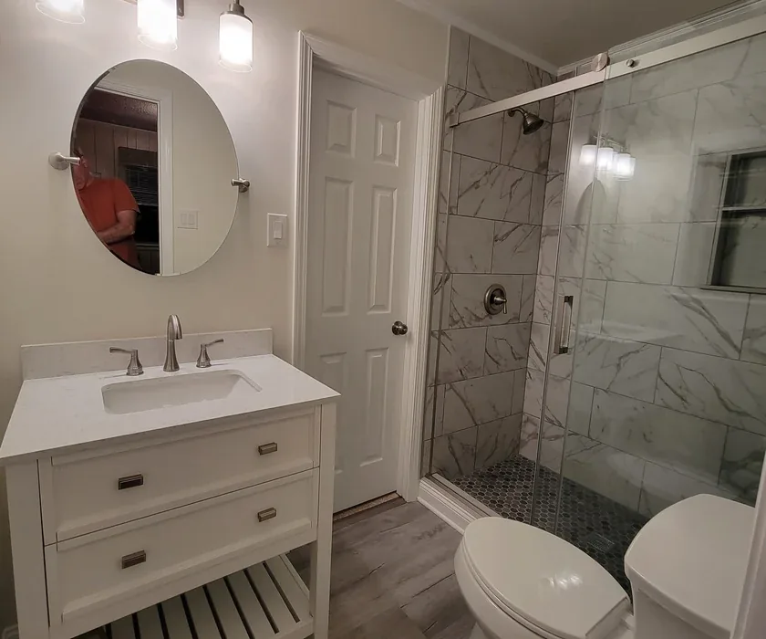 Remodeled bathroom with tiled walk-in shower and glass enclosure in a Charlotte, NC home