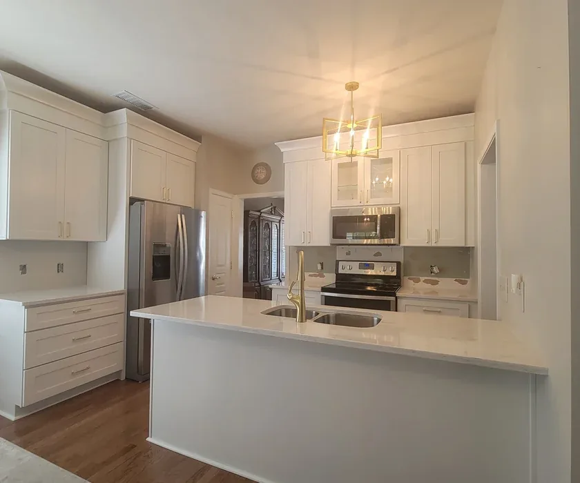 Remodeled kitchen with shaker cabinets, stone countertops and tile backsplash in Charlotte, NC